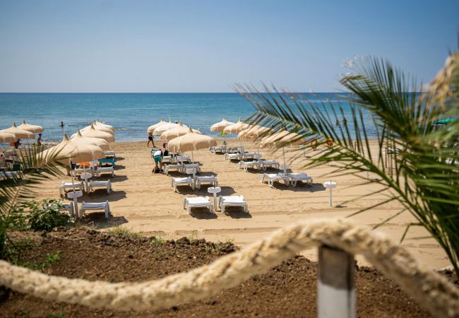 Relaxing atmosphere at the beachside resort on the sandy beach at Le Castella